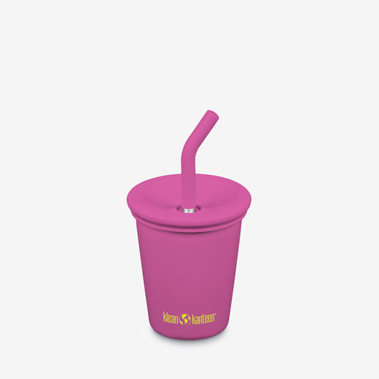 Pink kids sippy cup with straw on a light gray background