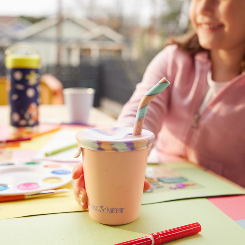 Close up of kid's sippy cup with straw