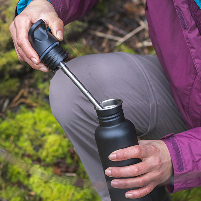 Pulling straw and Flip Seal Sport cap off bottle