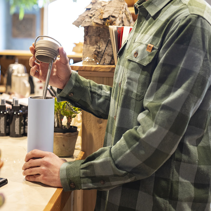 Twist cap with steel straw in coffee shop